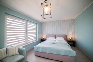 Postel nebo postele na pokoji v ubytování Apart Harmony - Apartamenty Baltic Harmony