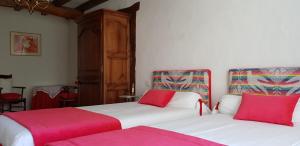 two beds sitting next to each other in a bedroom at BIDACHUNA in Saint-Pée-sur-Nivelle