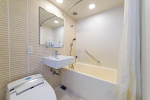 Koupelna v ubytování Nishitetsu Resort Inn Naha
