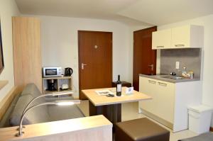 Kuchyň nebo kuchyňský kout v ubytování Hana Aparthotel