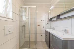a bathroom with a glass shower and a sink at VILA KIKA in Rogoznica +113 photos