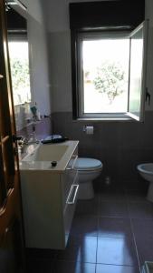 Et badeværelse på Appartamento Ganzirri