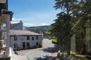 a winding street in a small village with a building at Grizedale View in Coniston
