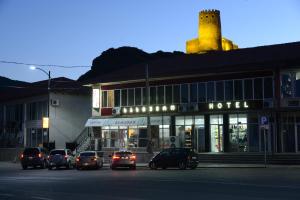 a group of cars parked in front of a hotel at Hotel Like in Akhaltsikhe