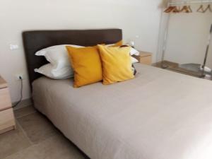 En eller flere senge i et værelse på Casa Gisella
