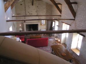 an overhead view of a living room with a fireplace at La Ferme Du Luc in Le Chêne