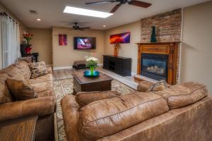 a living room with two couches and a fireplace at Lantern Light Inn - Romantic Getaway in Sedona