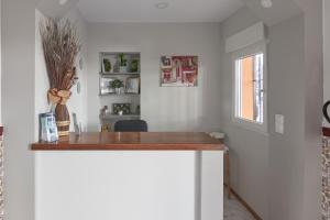 a kitchen with a wooden counter top in a room at Hostal Guerra in Marbella