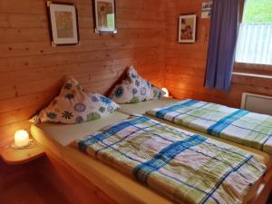 Postel nebo postele na pokoji v ubytování Milena-Hütte