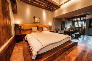 Postel nebo postele na pokoji v ubytování Yunlu Lianxin Guesthouse + 37 fotografií