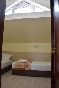 A bed or beds in a room at Aparthotel Lucky Family