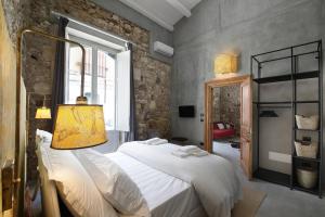 Postel nebo postele na pokoji v ubytování ISONZO SUITES