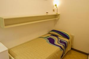 Ένα ή περισσότερα κρεβάτια σε δωμάτιο στο Appartamento SOYUS 10