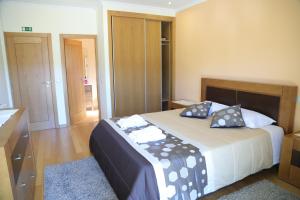Ένα ή περισσότερα κρεβάτια σε δωμάτιο στο BellaVista Alojamento