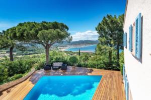 a villa with a swimming pool and a view at Villa with Magic view of Bay of Saint Tropez in Saint-Tropez
