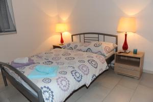 Postel nebo postele na pokoji v ubytování Apartmani Ivišić