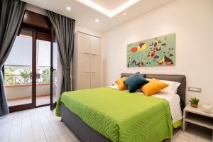A bed or beds in a room at Cilento Suite - Vinarte B&B