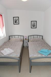Postel nebo postele na pokoji v ubytování Apartmani Ivišić