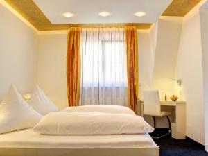 Postel nebo postele na pokoji v ubytování Hotel Linde