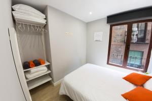 a small bedroom with a bed and a window at Nuñez de Arce in Toledo