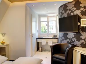 TV a/nebo společenská místnost v ubytování Hotel Linde