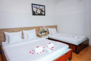 Postel nebo postele na pokoji v ubytování H79 HOTEL