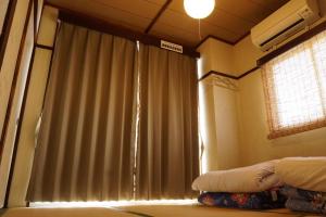 Postel nebo postele na pokoji v ubytování Hostel Tomal