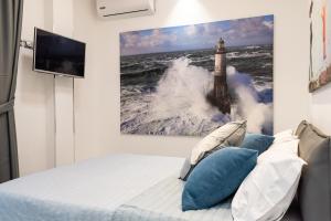 A bed or beds in a room at Cilento Suite - Vinarte B&B