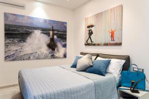 A bed or beds in a room at Cilento Suite - Vinarte B&B