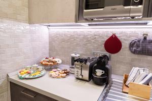 A kitchen or kitchenette at Cilento Suite - Vinarte B&B