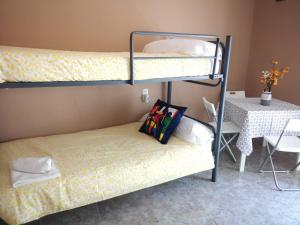 Litera o literas de una habitación en La Maestranza Apartment Rooms