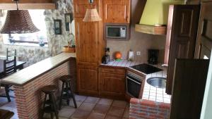 Kuchyň nebo kuchyňský kout v ubytování LAS VILLAS DEL PONTON