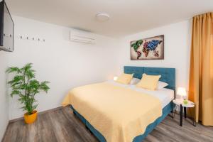 Postel nebo postele na pokoji v ubytování Rooms L17