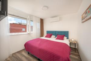 Postel nebo postele na pokoji v ubytování Rooms L17