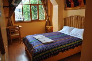 Postel nebo postele na pokoji v ubytování Hotel Santafe Inn
