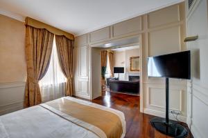 TV a/nebo společenská místnost v ubytování Hotel Rua Frati 48 in San Francesco