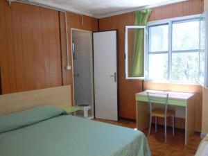 Letto o letti in una camera di Pensione San Michele