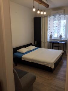 Posteľ alebo postele v izbe v ubytovaní Apartman Licia