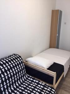 Posteľ alebo postele v izbe v ubytovaní Apartman Licia