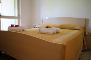 Postel nebo postele na pokoji v ubytování Hotel L'Ancora