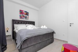 Postel nebo postele na pokoji v ubytování Apartments Morpheus