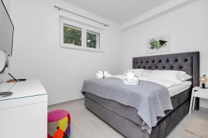 Postel nebo postele na pokoji v ubytování Apartments Morpheus