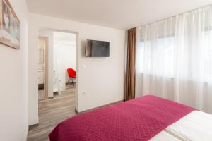 Postel nebo postele na pokoji v ubytování Rooms L17