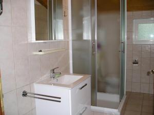 a bathroom with a sink and a shower at Apartments Ivo - sea view terrace in Veli Rat