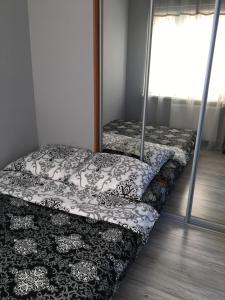 Una cama o camas en una habitación de Iwona