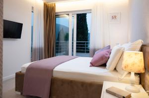 Postel nebo postele na pokoji v ubytování Luxury Apartment Mr. Perfect