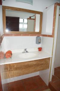 a bathroom with a sink and a mirror at Puerto Lobos Dive camp in Tamiahua