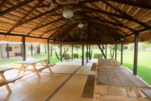 a group of picnic tables in a pavilion at Puerto Lobos Dive camp in Tamiahua