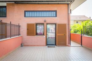an open door of a brick building with a brick at Modern Loft Apartment in Rome