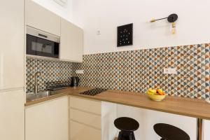 A kitchen or kitchenette at Royal Ferenciek Apartment